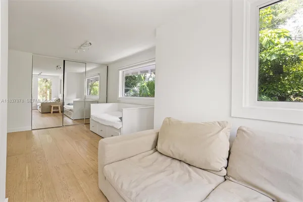 a living room with furniture and a large window