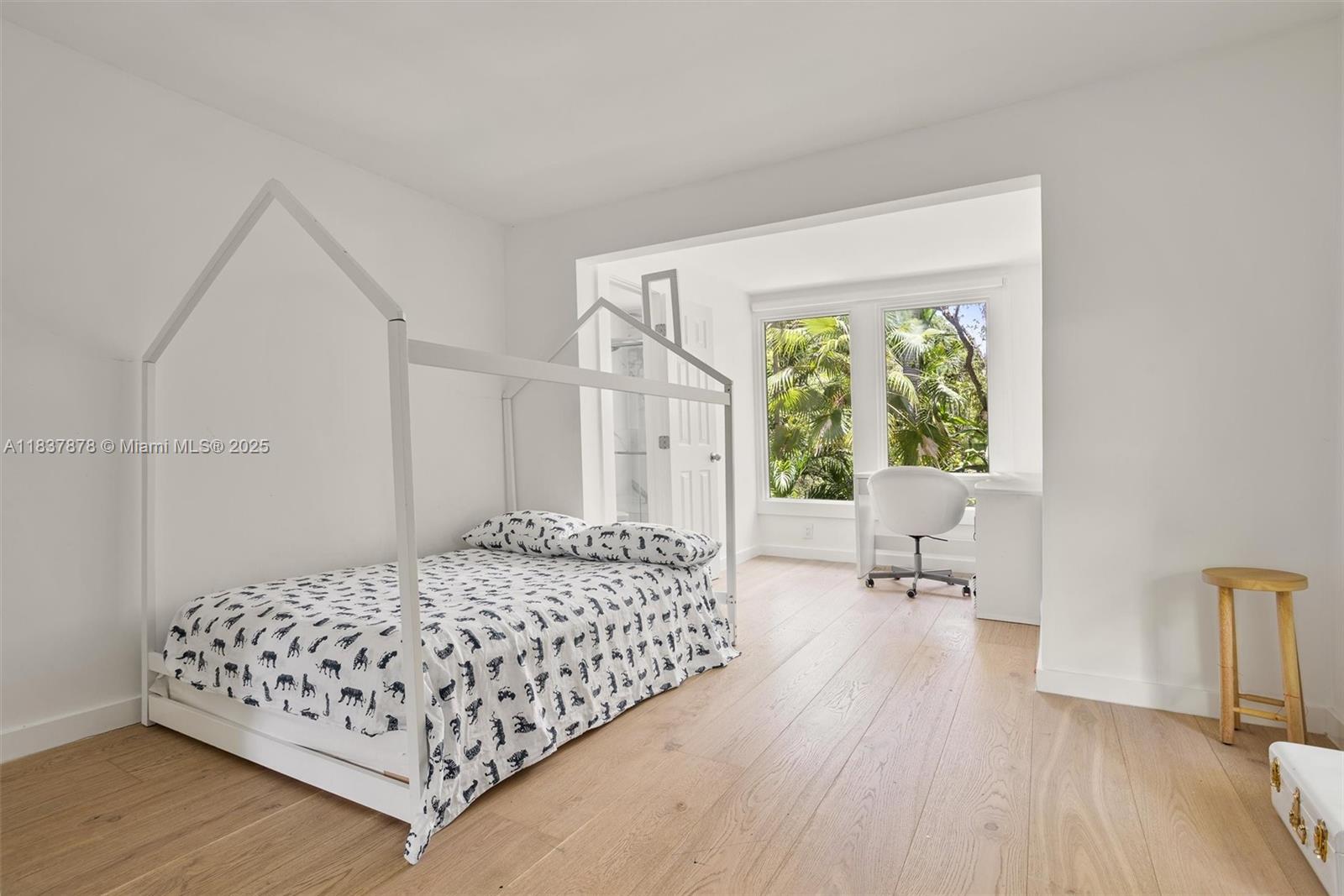 4286 Douglas Road Miami, FL 33133 - Photo 29 of 51 a bedroom with a bed and a large window