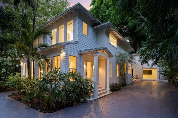 a front view of a house with garden