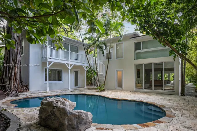 a view of a house with swimming pool