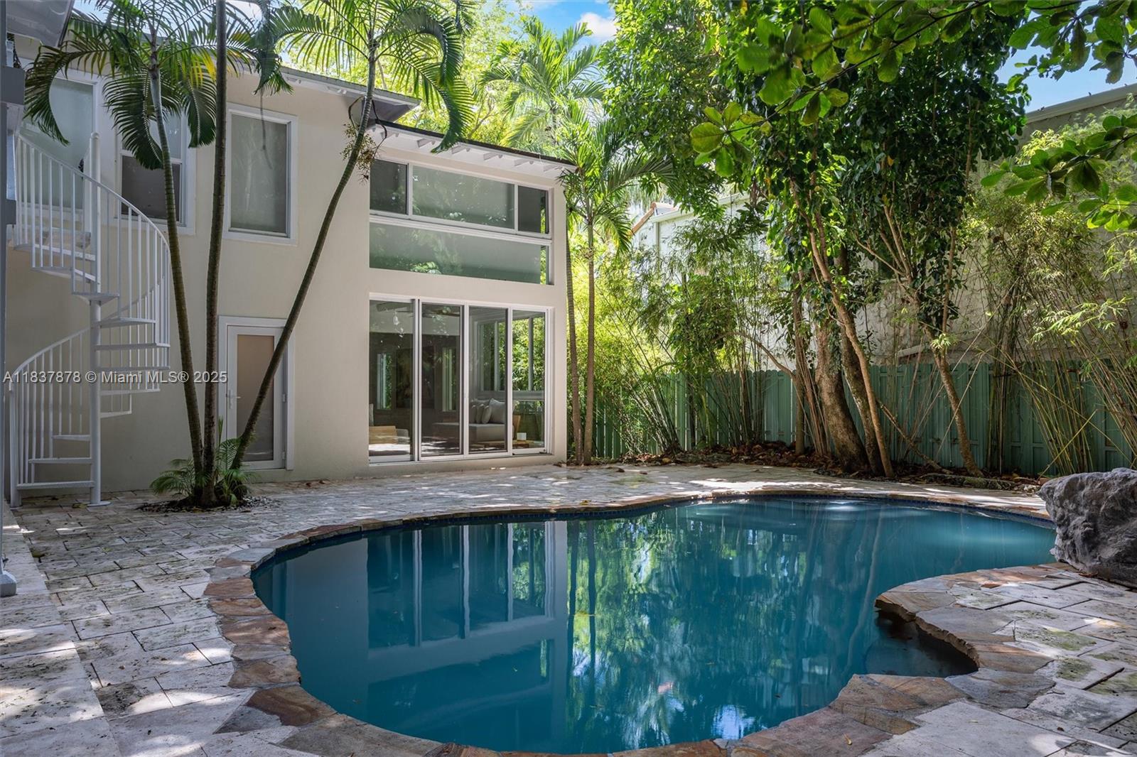 4286 Douglas Road Miami, FL 33133 - Photo 43 of 51 a view of a house with backyard and sitting area