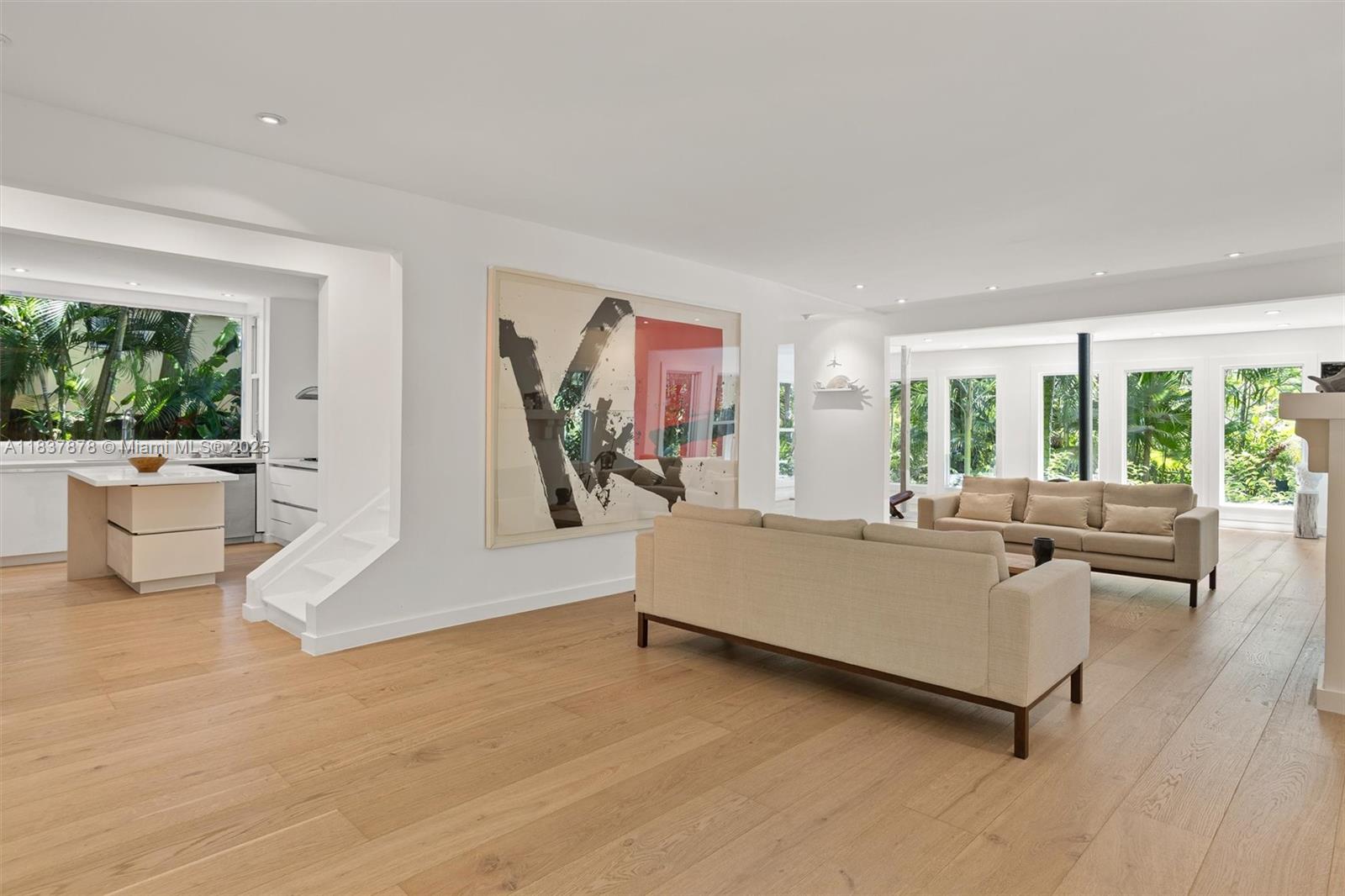 4286 Douglas Road Miami, FL 33133 - Photo 8 of 51 a living room with furniture and a large window