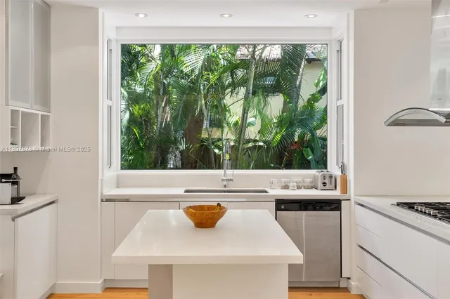 a view of a kitchen with a stove top oven