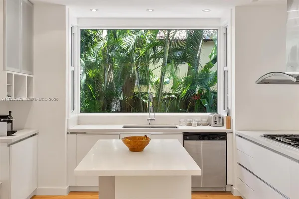 a view of a kitchen with a stove top oven