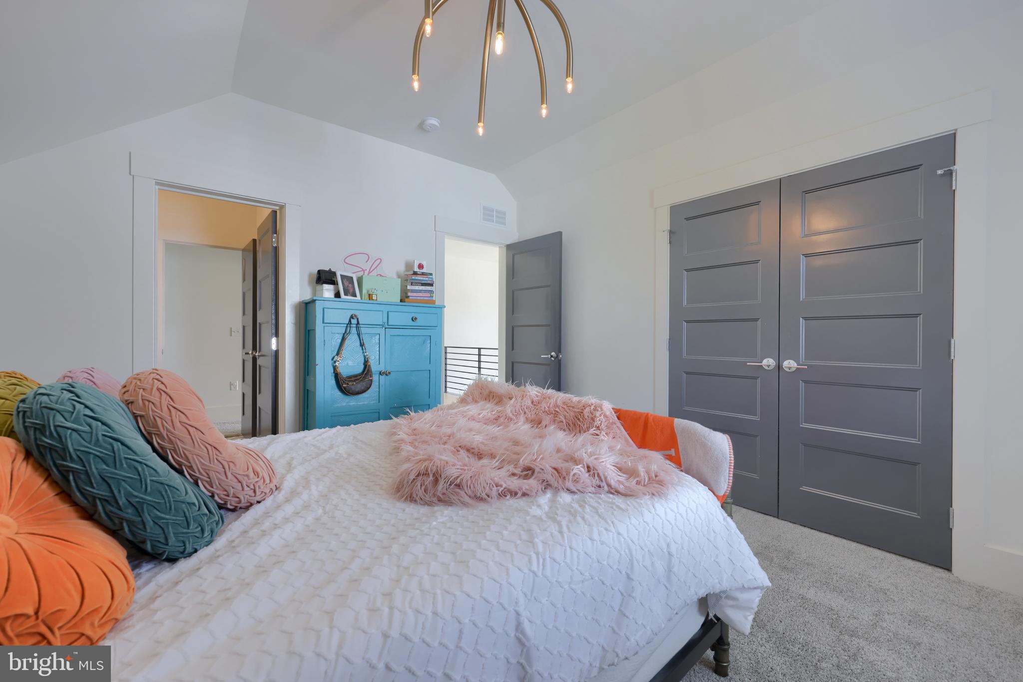 604 Stonehenge Drive Lititz, PA 17543 - Photo 25 of 41 a bedroom with a bed and a chandelier