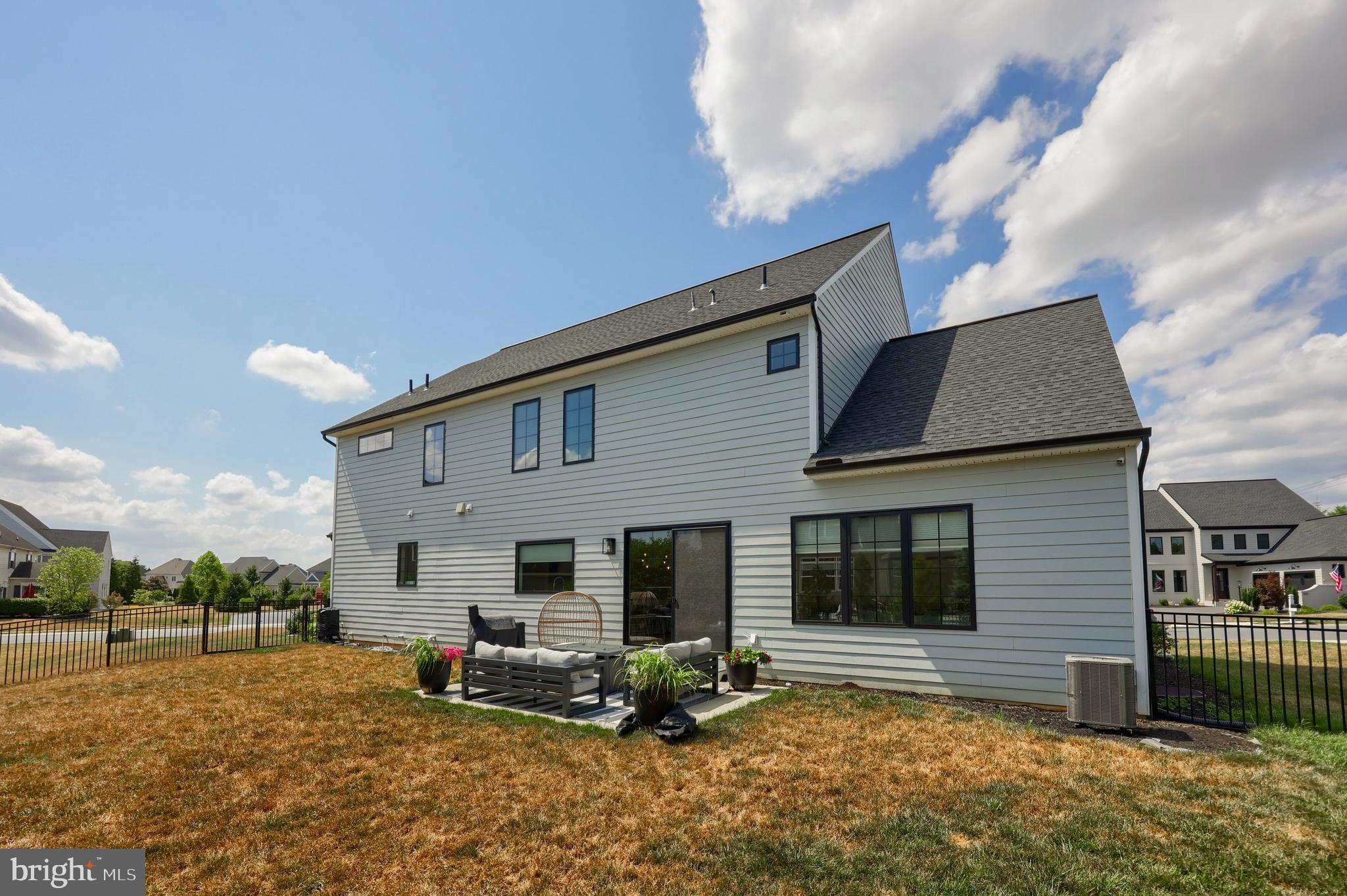 604 Stonehenge Drive Lititz, PA 17543 - Photo 3 of 41 a backyard of a house with seating space