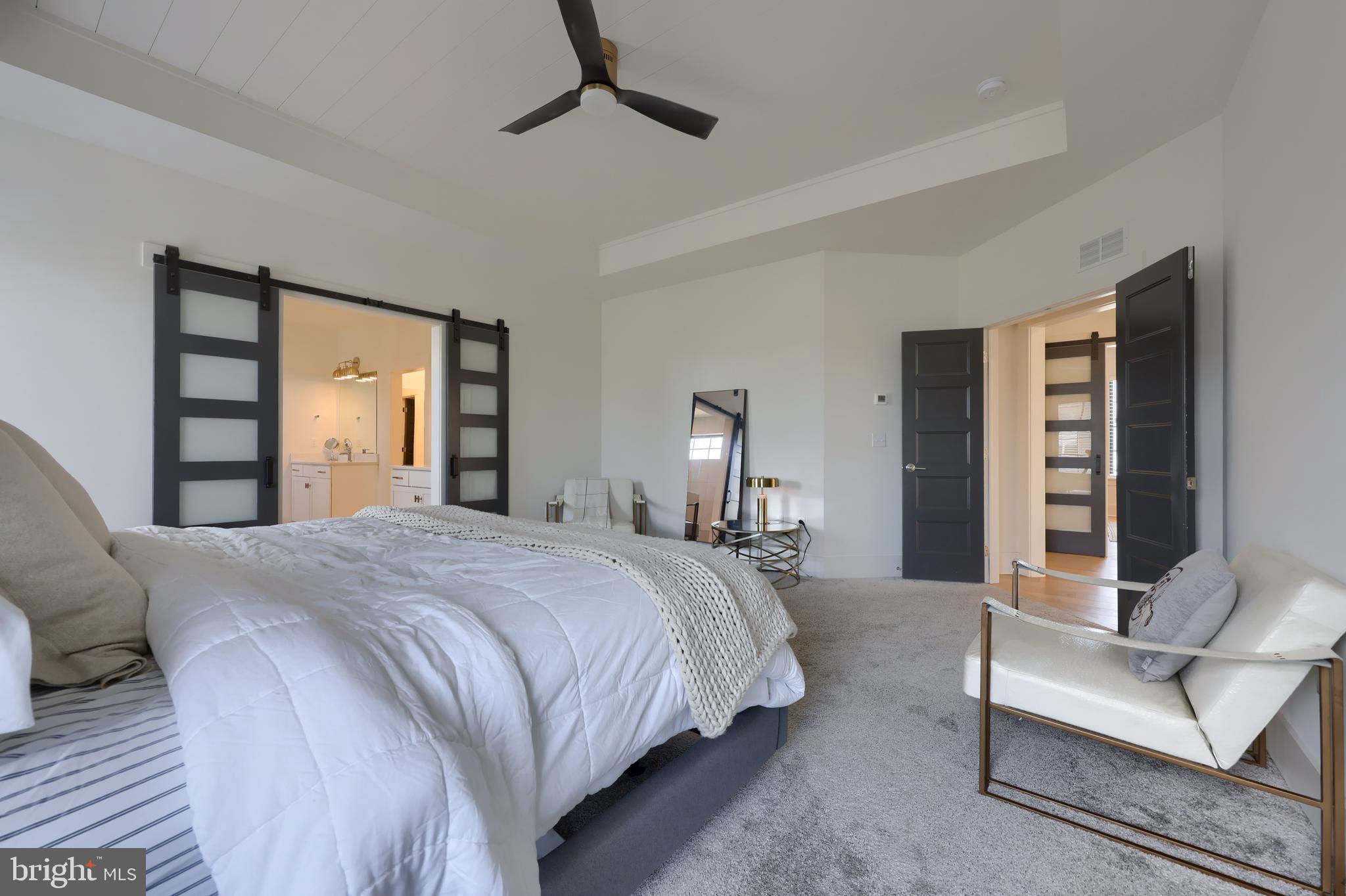 604 Stonehenge Drive Lititz, PA 17543 - Photo 36 of 41 a bedroom with a large bed and a couch