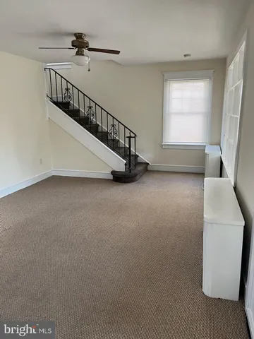 a view of a livingroom with a staircase