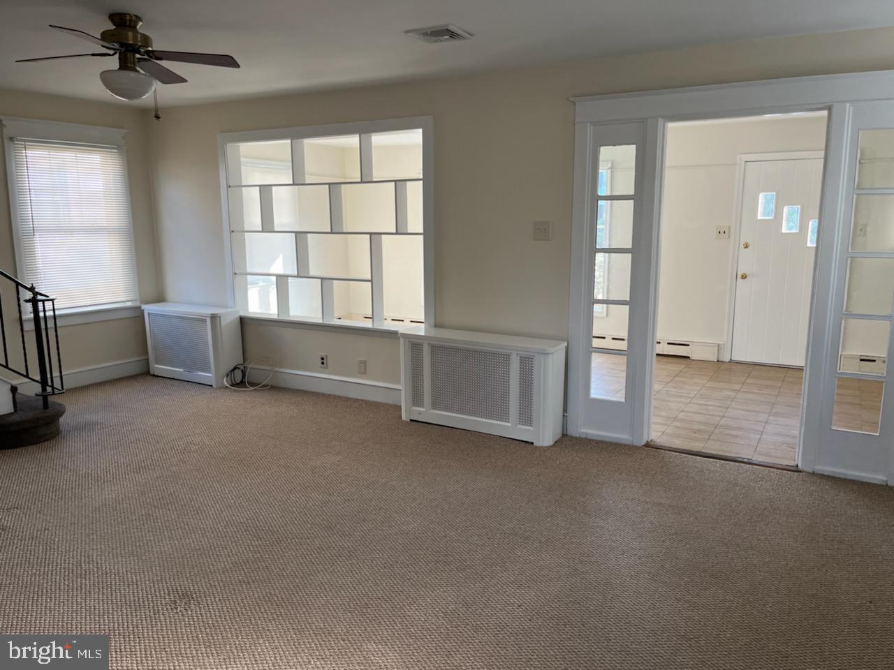 2317 Jenkintown Road Glenside, PA 19038 - Photo 9 of 16 an empty room with windows and cabinet