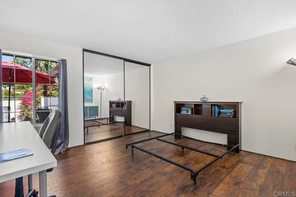 a living room with furniture a air conditioner and a window