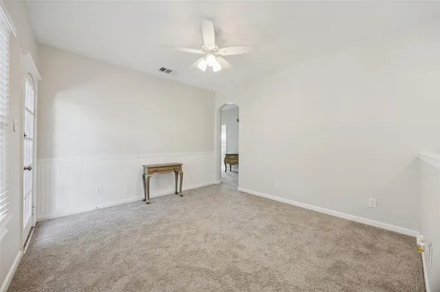 an empty room with a fan