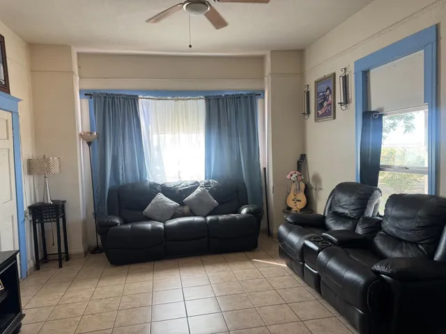 a living room with furniture and a window