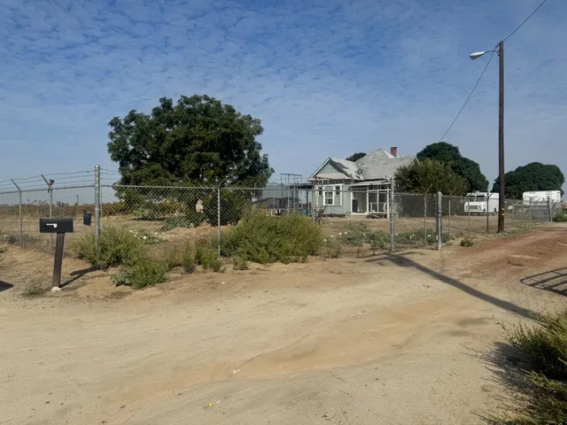 a view of a street with a building in the background