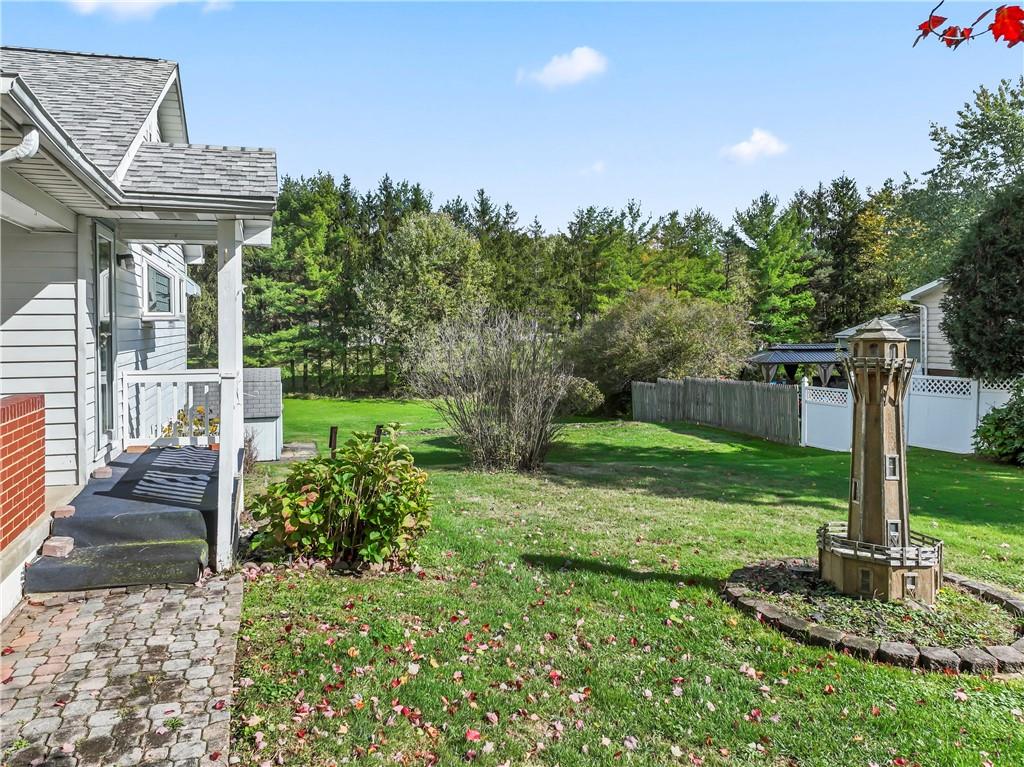122 Georgetown Road Beaver Falls, PA 15010 - Photo 13 of 44 a front view of a house with garden