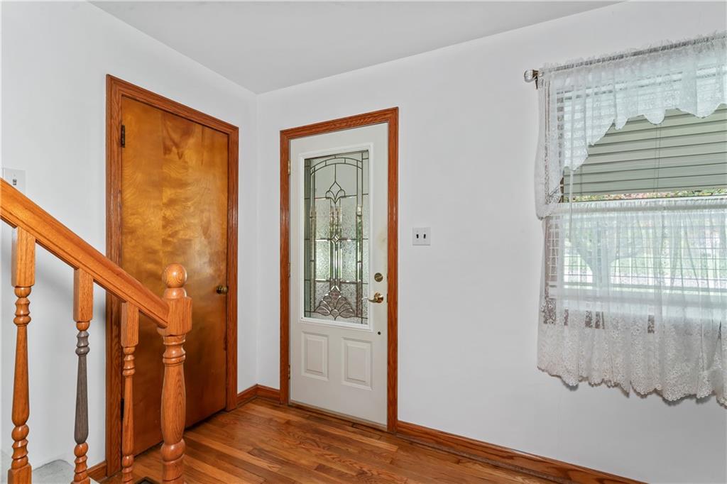 122 Georgetown Road Beaver Falls, PA 15010 - Photo 17 of 44 a view of a room with wooden floor and windows