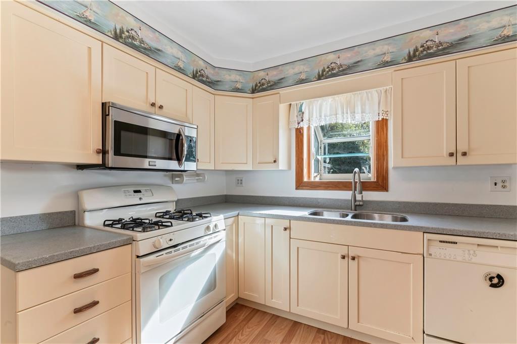 122 Georgetown Road Beaver Falls, PA 15010 - Photo 23 of 44 a kitchen with granite countertop white cabinets white appliances and granite counter tops