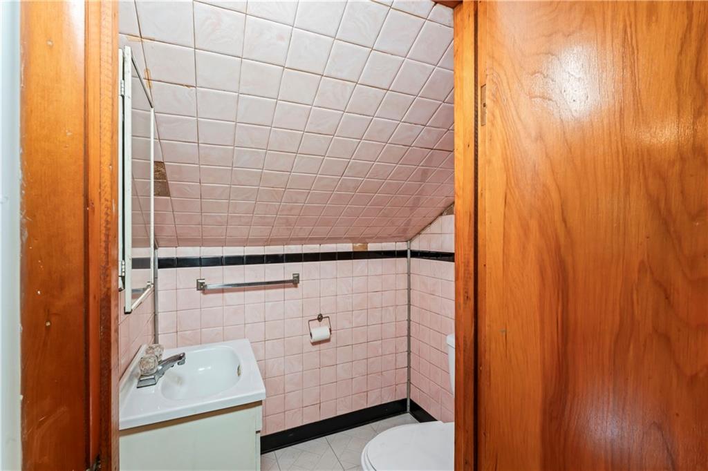 122 Georgetown Road Beaver Falls, PA 15010 - Photo 32 of 44 a bathroom with a shower and a sink