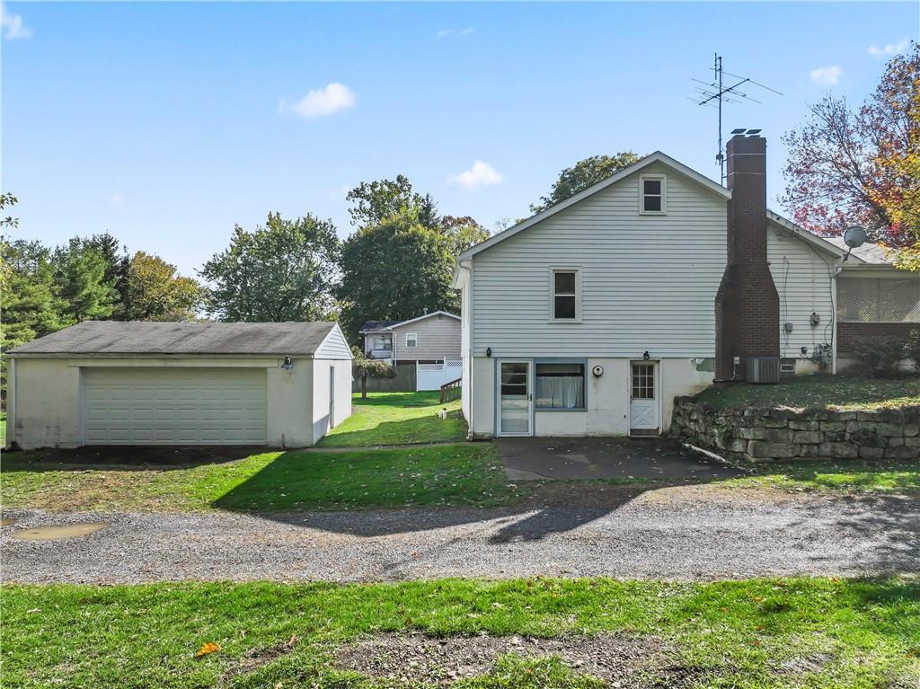 122 Georgetown Road Beaver Falls, PA 15010 - Photo 4 of 44 a front view of a house with a yard and garage
