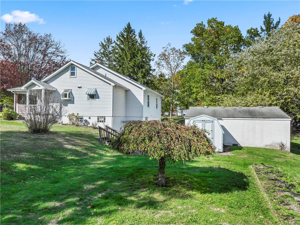 122 Georgetown Road Beaver Falls, PA 15010 - Photo 6 of 44 a view of a house with a yard and a garden