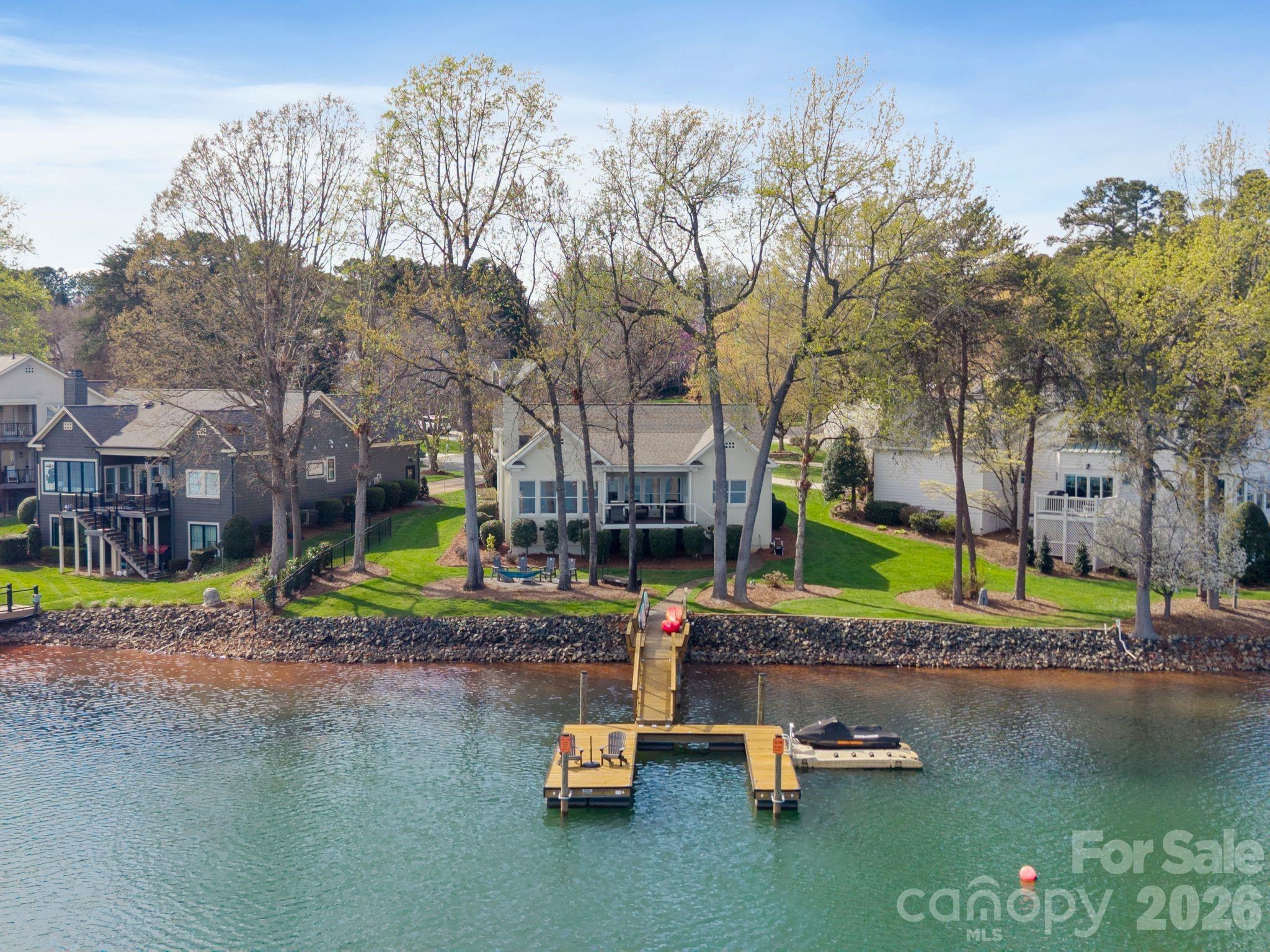 17723 Springwinds Drive Cornelius, NC 28031 - Photo 1 of 34 a view of pool with umbrella and trees
