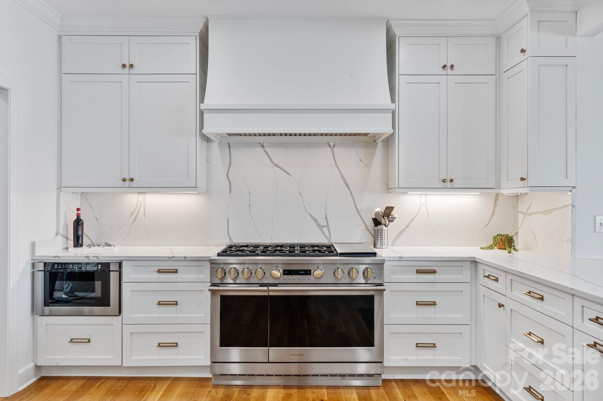 17723 Springwinds Drive Cornelius, NC 28031 - Photo 13 of 34 a stove top oven sitting inside of a kitchen