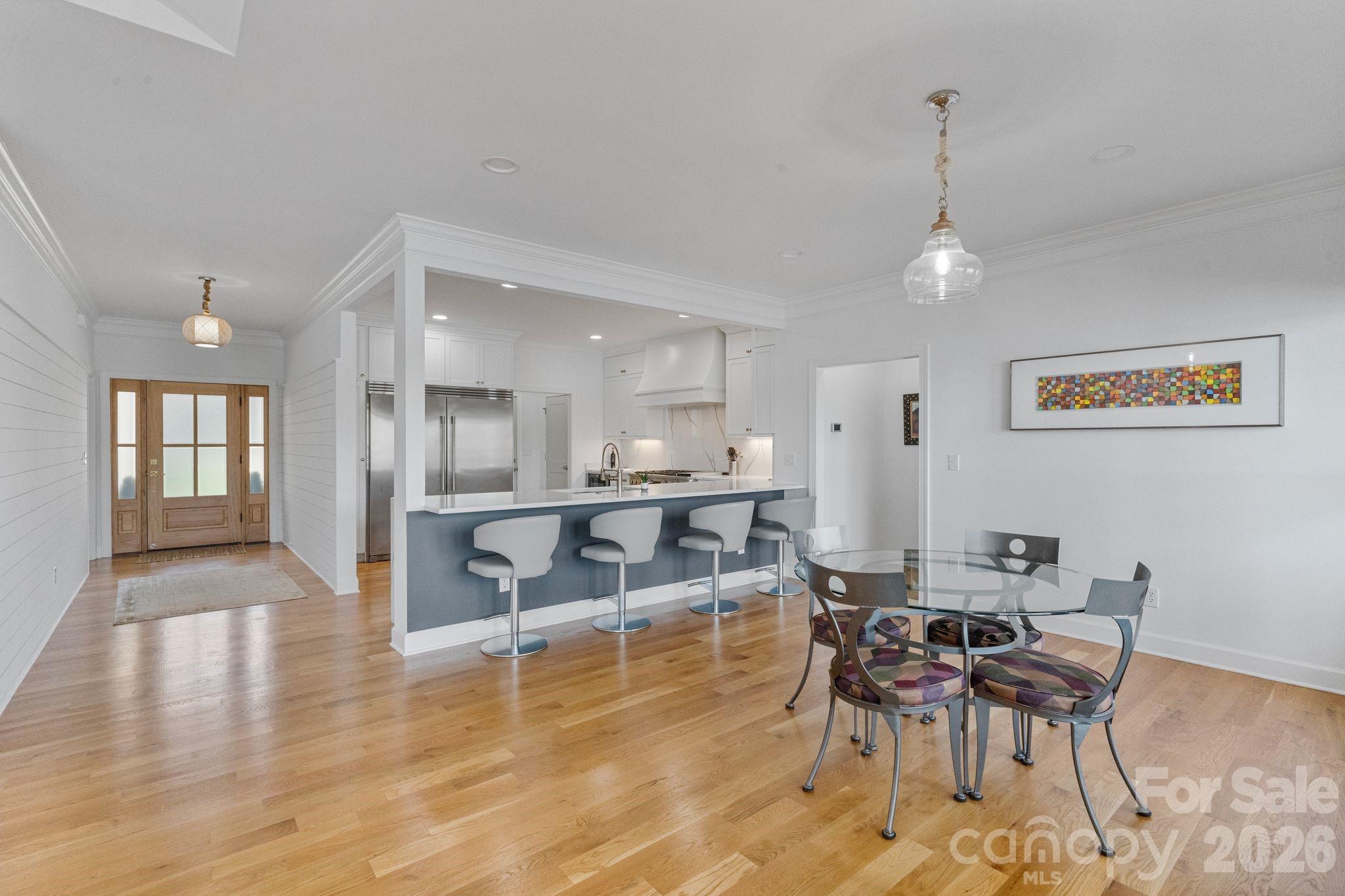 17723 Springwinds Drive Cornelius, NC 28031 - Photo 18 of 34 a dining room with furniture and wooden floor
