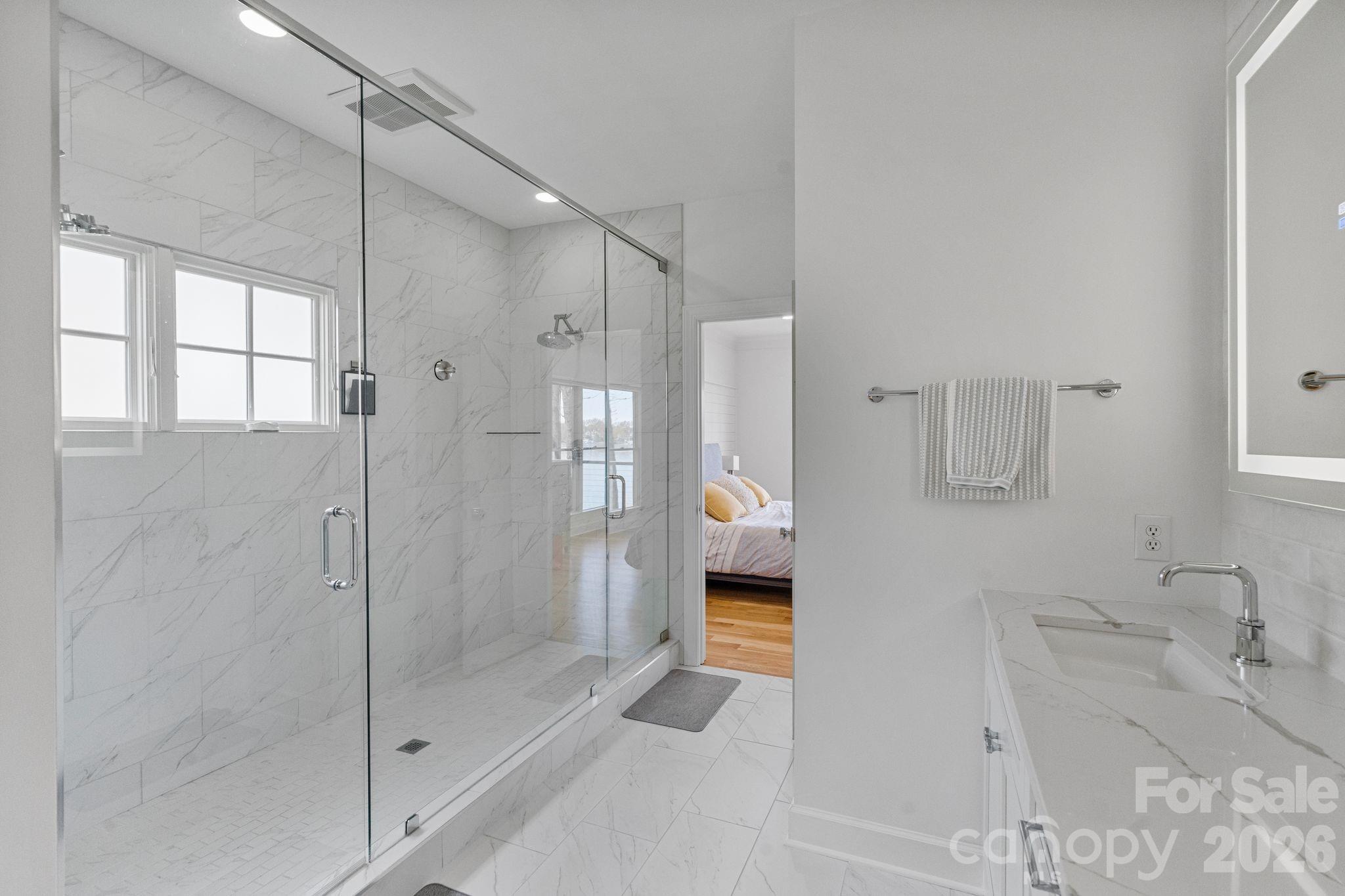 17723 Springwinds Drive Cornelius, NC 28031 - Photo 22 of 34 a bathroom with a shower and a sink