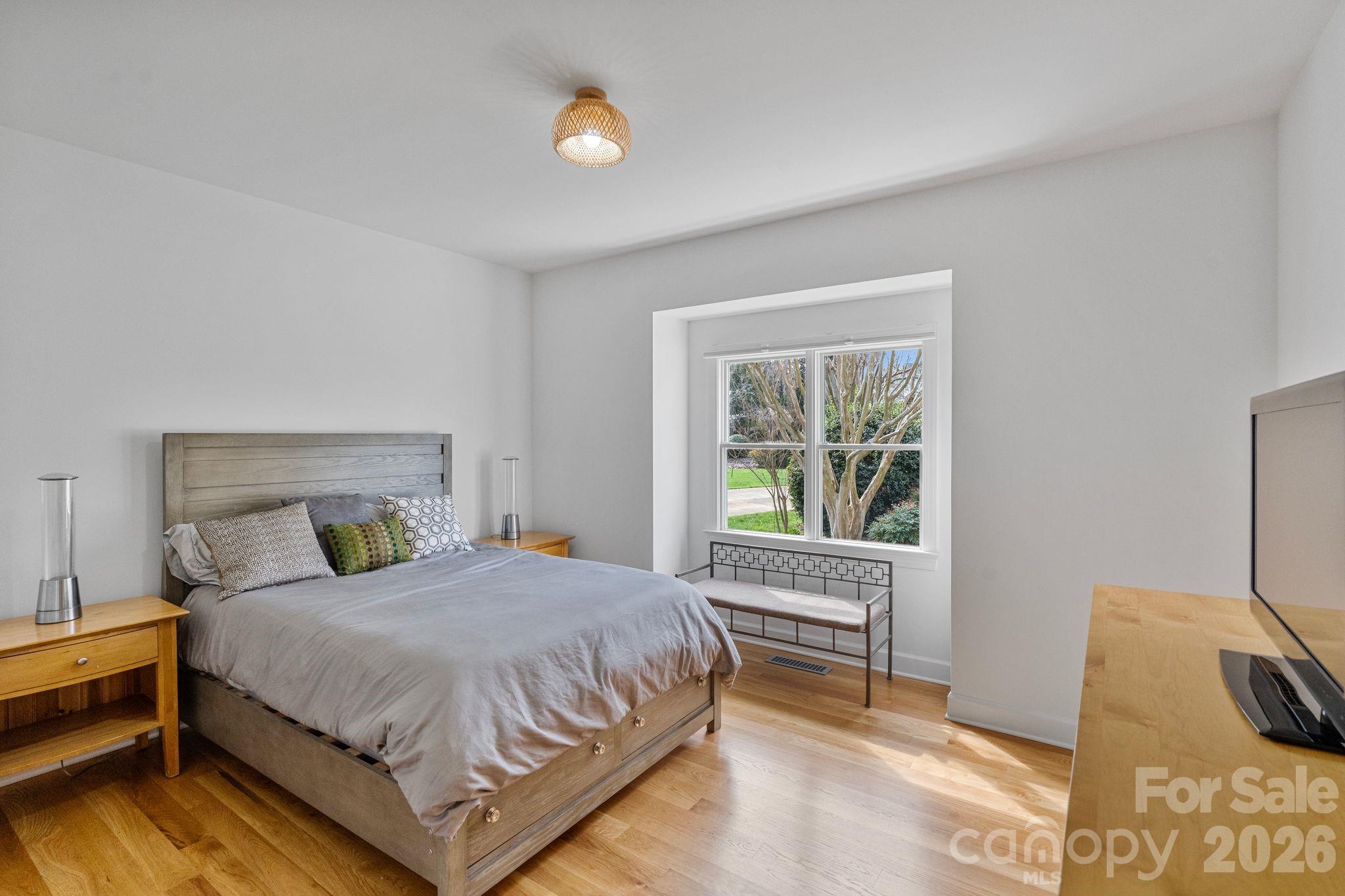 17723 Springwinds Drive Cornelius, NC 28031 - Photo 24 of 34 a bedroom with a bed and a window
