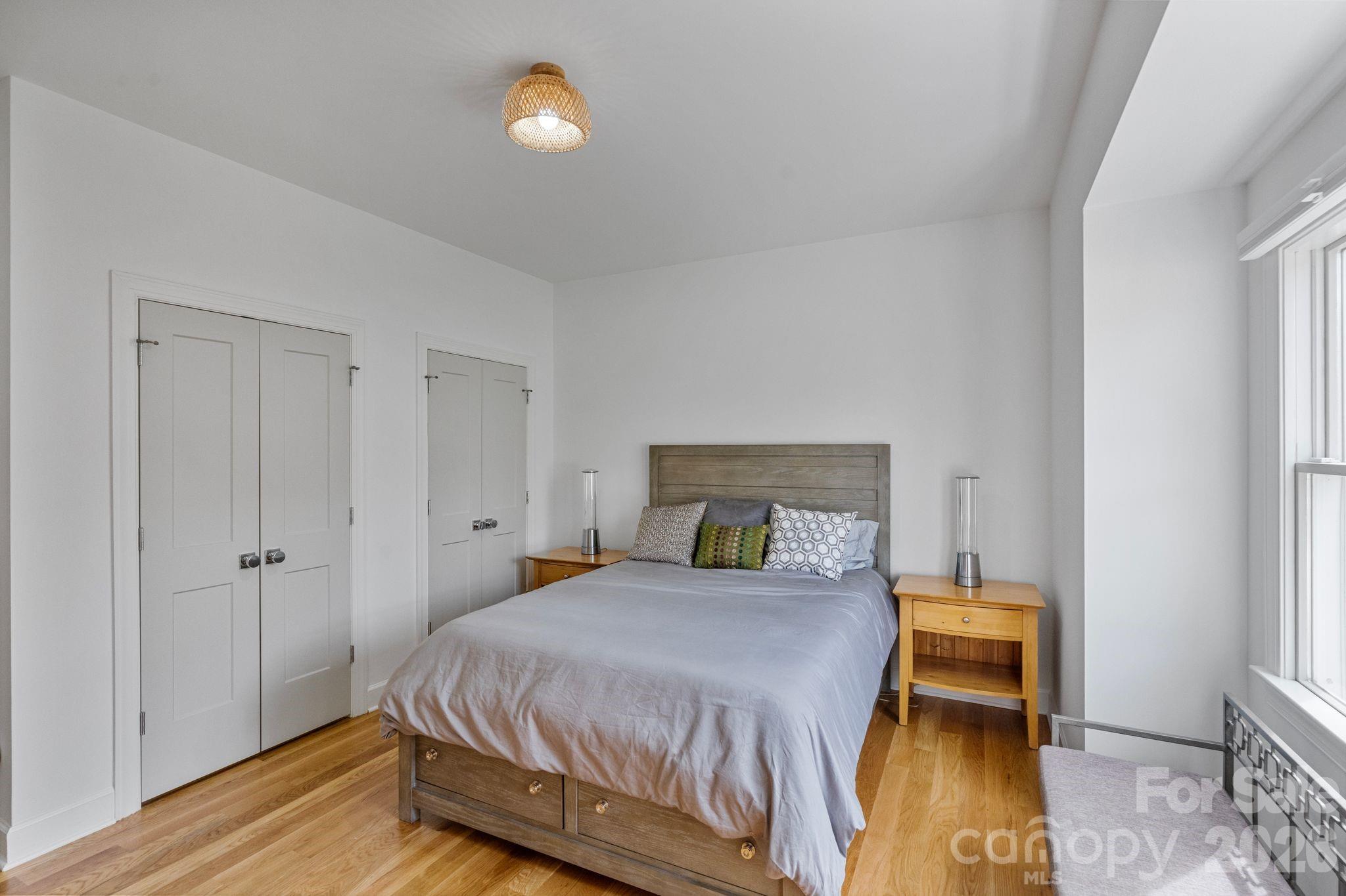 17723 Springwinds Drive Cornelius, NC 28031 - Photo 25 of 34 a bedroom with a bed and a table