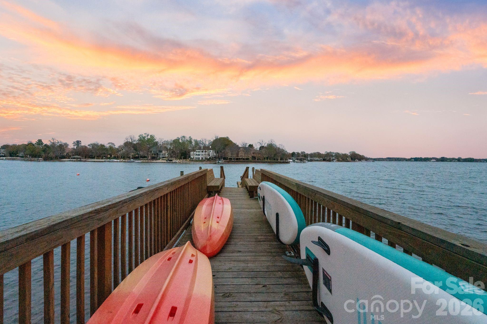 17723 Springwinds Drive Cornelius, NC 28031 - Photo 31 of 34 a view of roof deck with two chairs and wooden fence