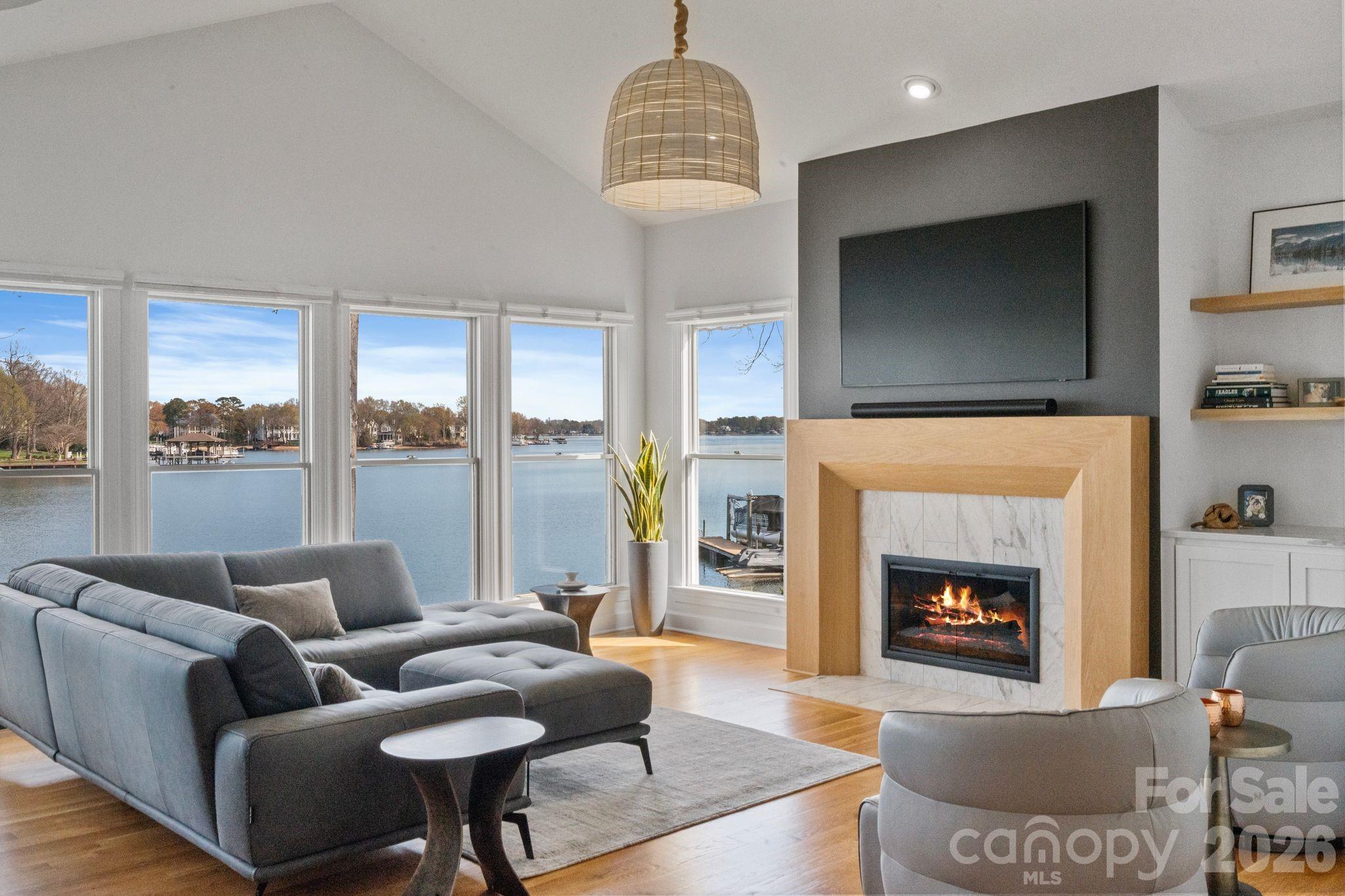 17723 Springwinds Drive Cornelius, NC 28031 - Photo 34 of 34 a living room with furniture and a fireplace