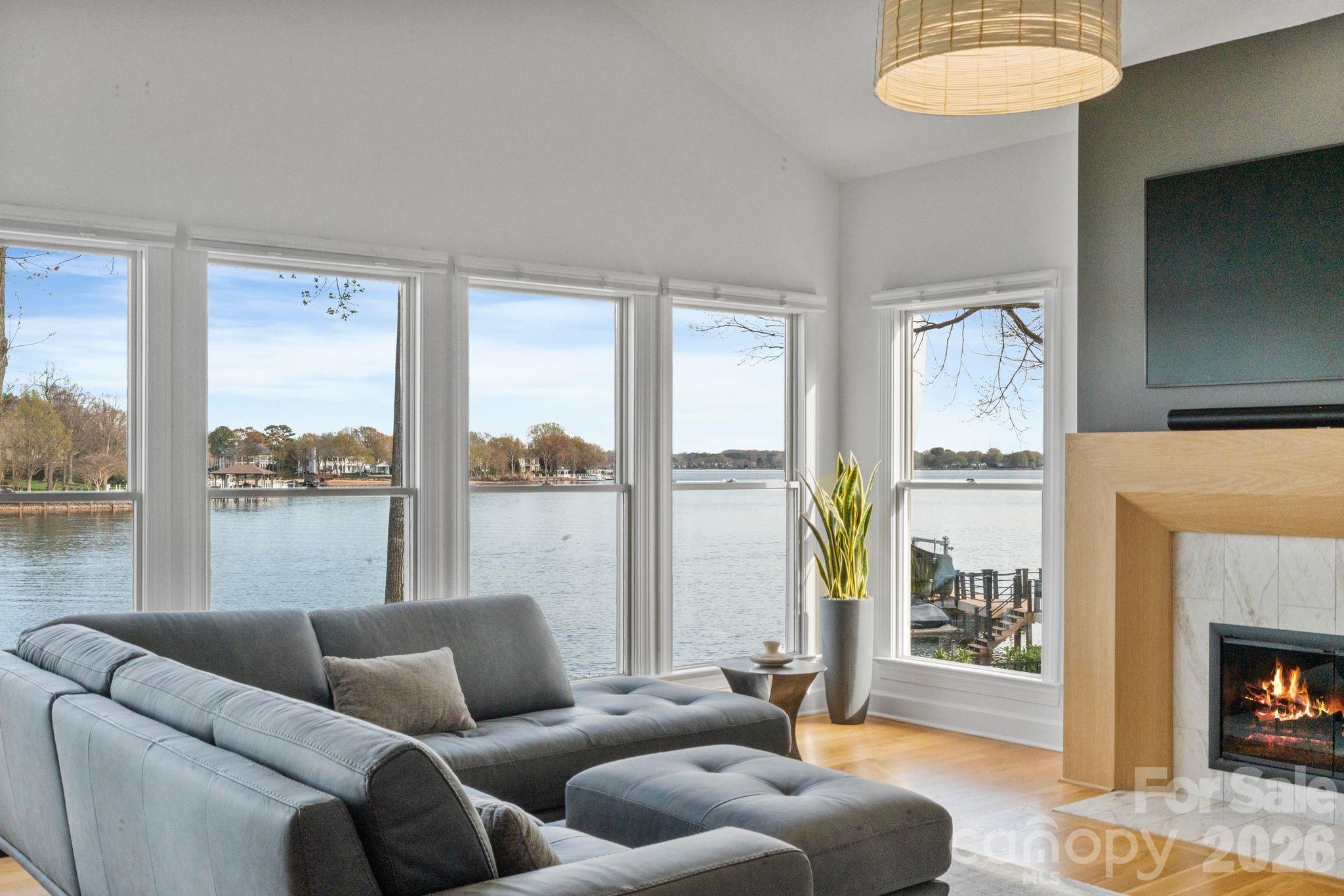 17723 Springwinds Drive Cornelius, NC 28031 - Photo 10 of 34 a living room with furniture and a fireplace