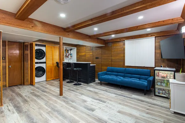 a bedroom with furniture and a wooden floor