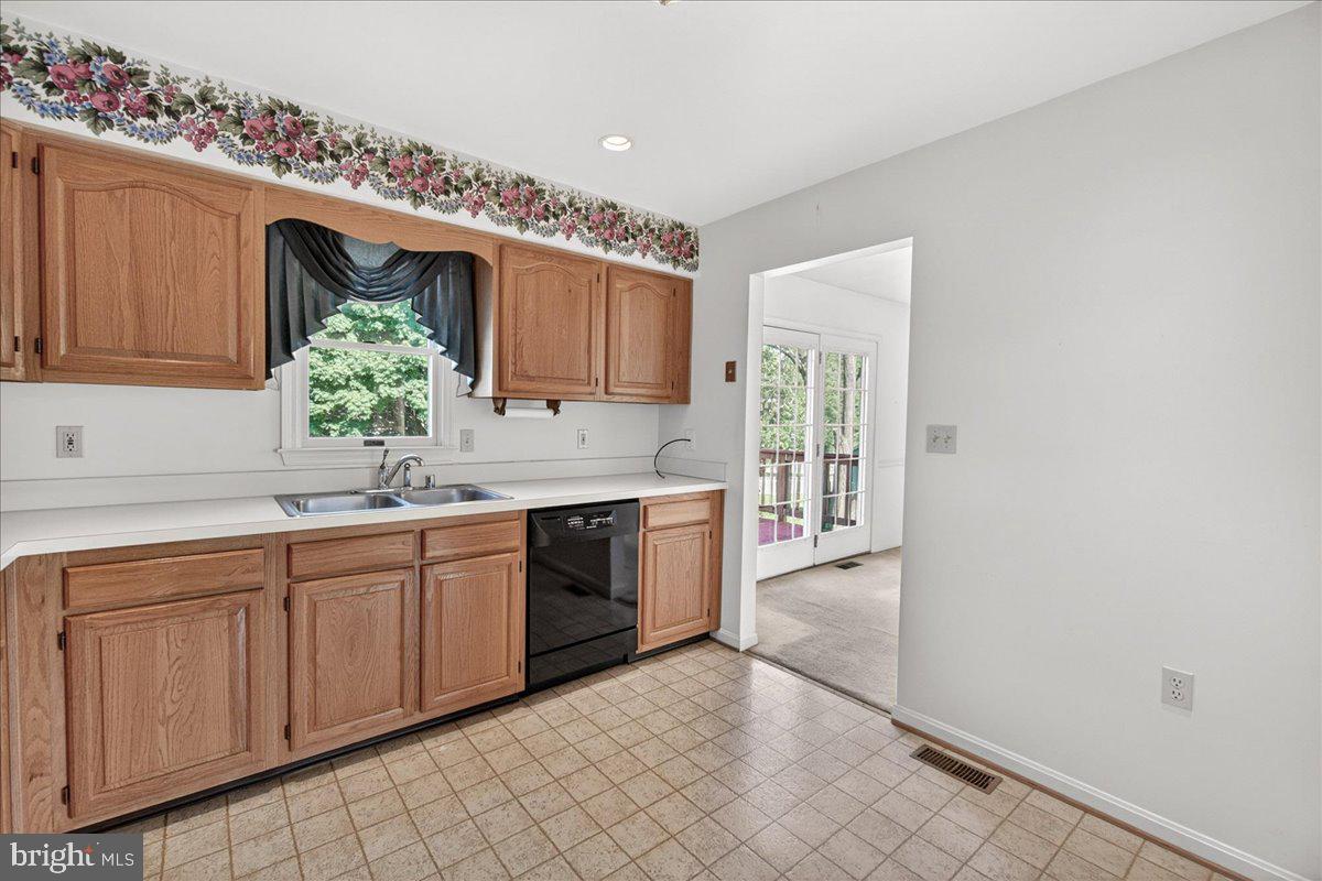 4715 Green Valley Road Monrovia, MD 21770 - Photo 15 of 36 a kitchen with granite countertop a sink and cabinets
