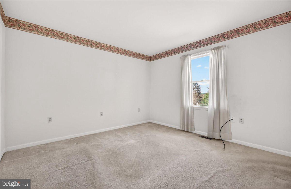 4715 Green Valley Road Monrovia, MD 21770 - Photo 16 of 36 a view of an empty room with a window