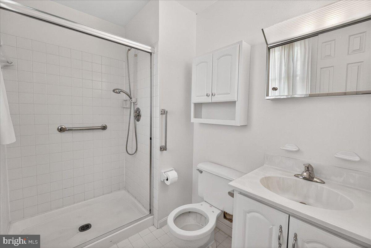 4715 Green Valley Road Monrovia, MD 21770 - Photo 18 of 36 a bathroom with a sink toilet and shower