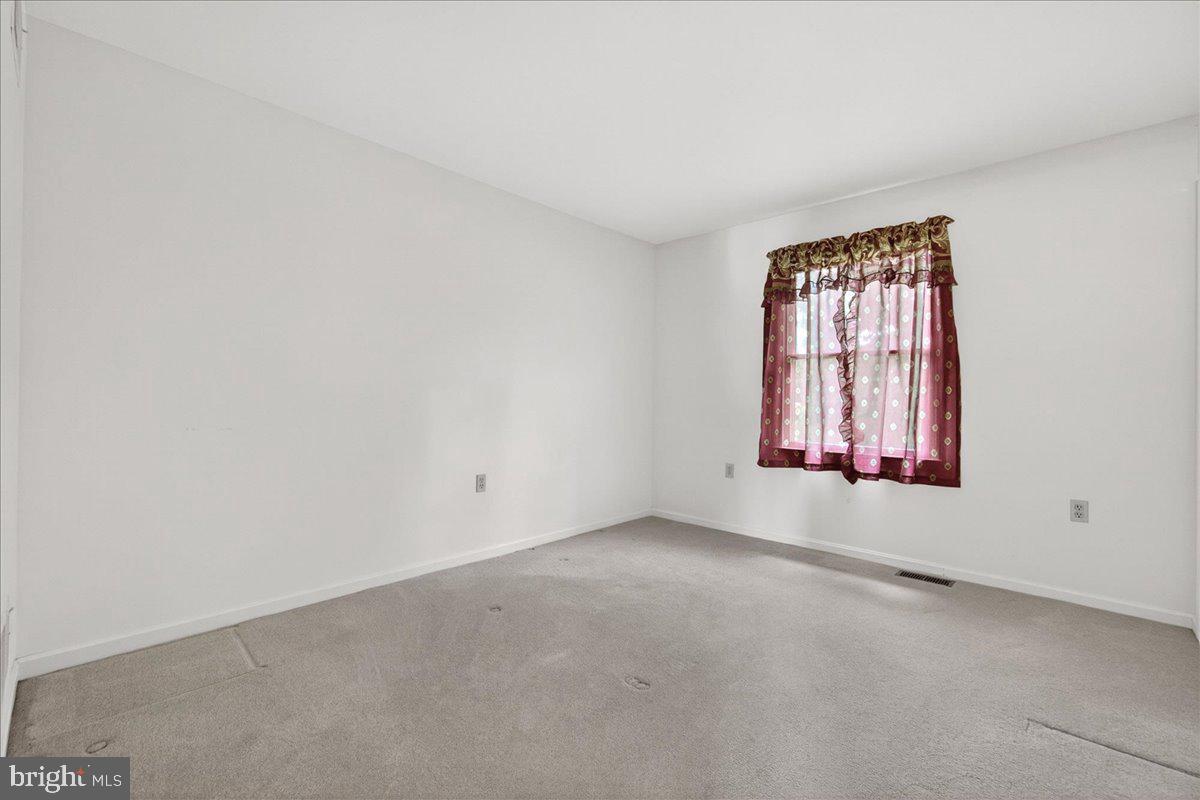 4715 Green Valley Road Monrovia, MD 21770 - Photo 19 of 36 an empty room with windows