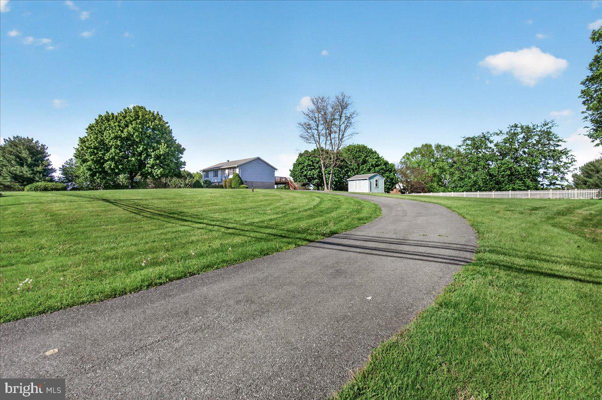 4715 Green Valley Road Monrovia, MD 21770 - Photo 2 of 36 a view of a big yard with large trees
