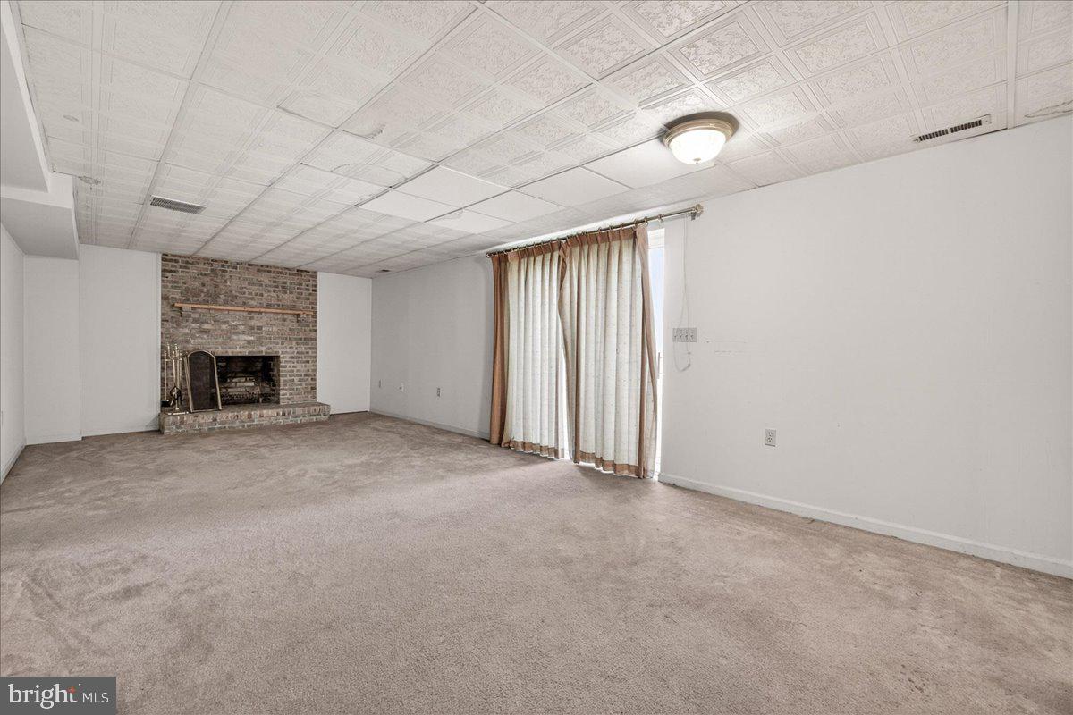 4715 Green Valley Road Monrovia, MD 21770 - Photo 22 of 36 wooden floor in an empty room with a fireplace