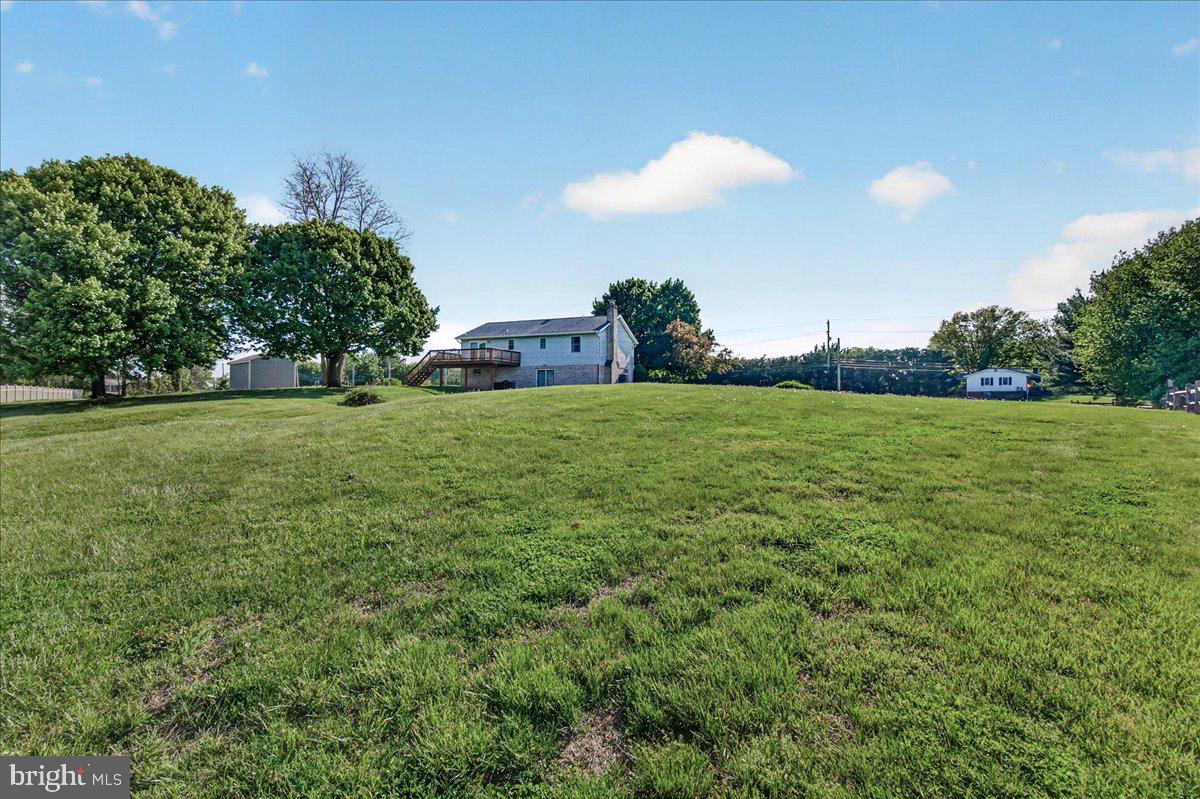4715 Green Valley Road Monrovia, MD 21770 - Photo 3 of 36 a view of a big yard with a fountain and a big yard