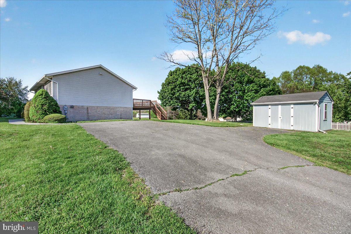4715 Green Valley Road Monrovia, MD 21770 - Photo 35 of 36 a front view of a house with a yard and garage