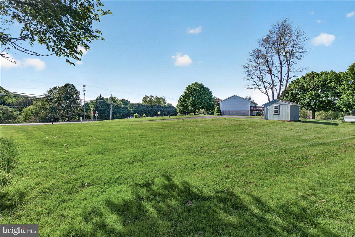 4715 Green Valley Road Monrovia, MD 21770 - Photo 36 of 36 a view of a grassy field with trees in the background