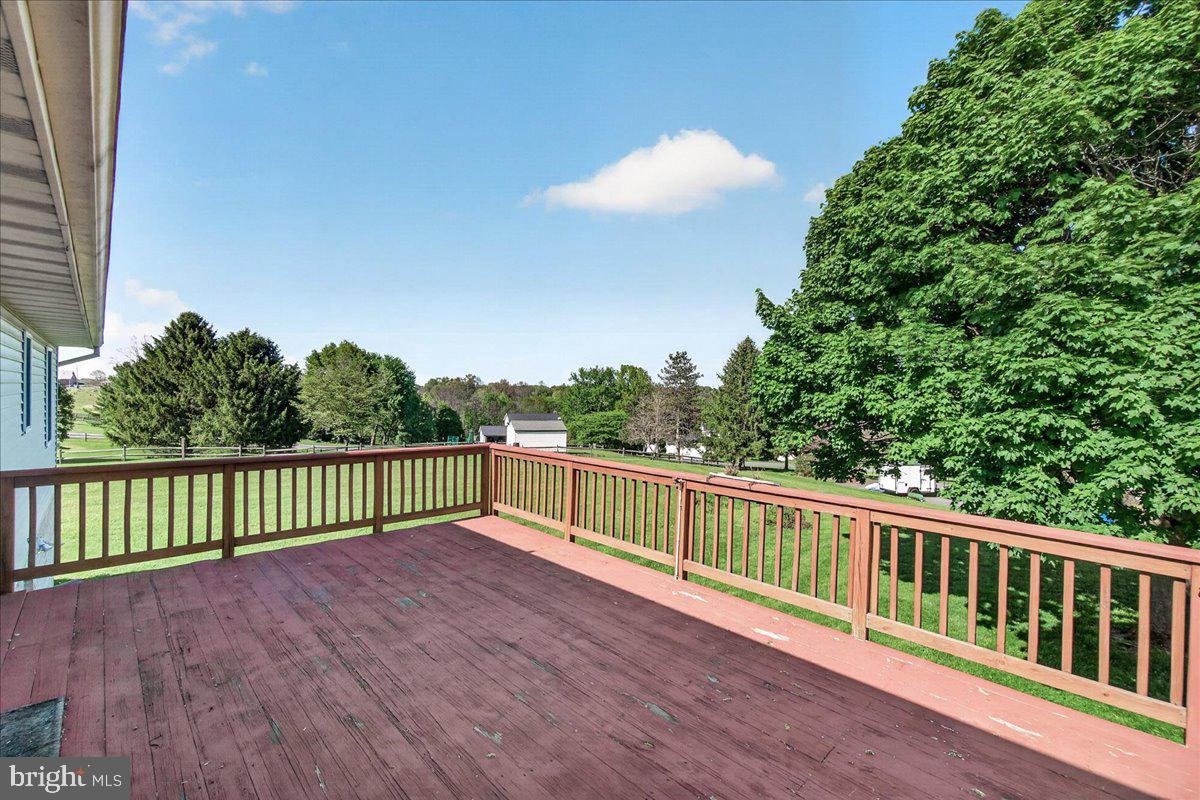 4715 Green Valley Road Monrovia, MD 21770 - Photo 10 of 36 a view of balcony with wooden floor and fence