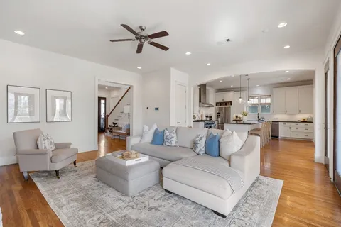 a view of entryway with furniture and wooden floor