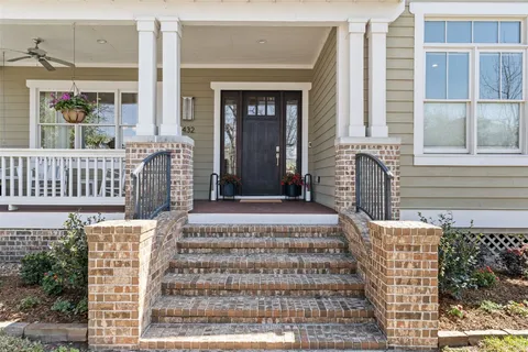 a front view of a house with a porch