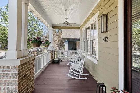 a view of an entryway with wooden floor and a livingroom view