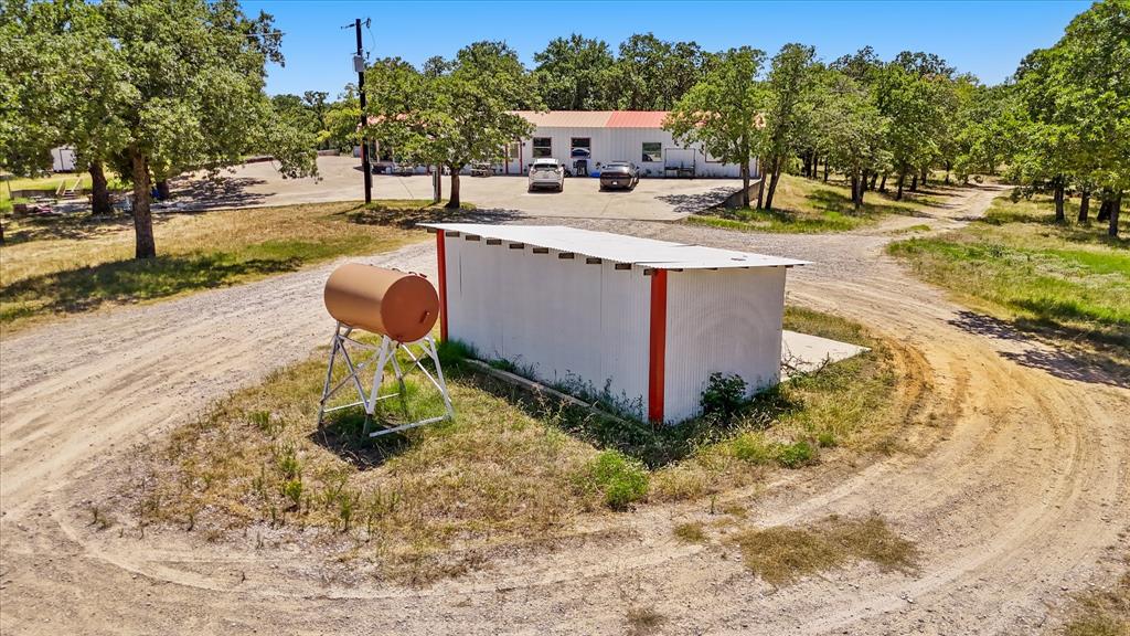 283 County Road 4794 Boyd, TX 76023 - Photo 7 of 17 a swimming pool with some trees in the background