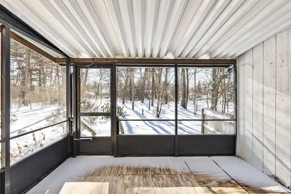 a view of empty room with windows