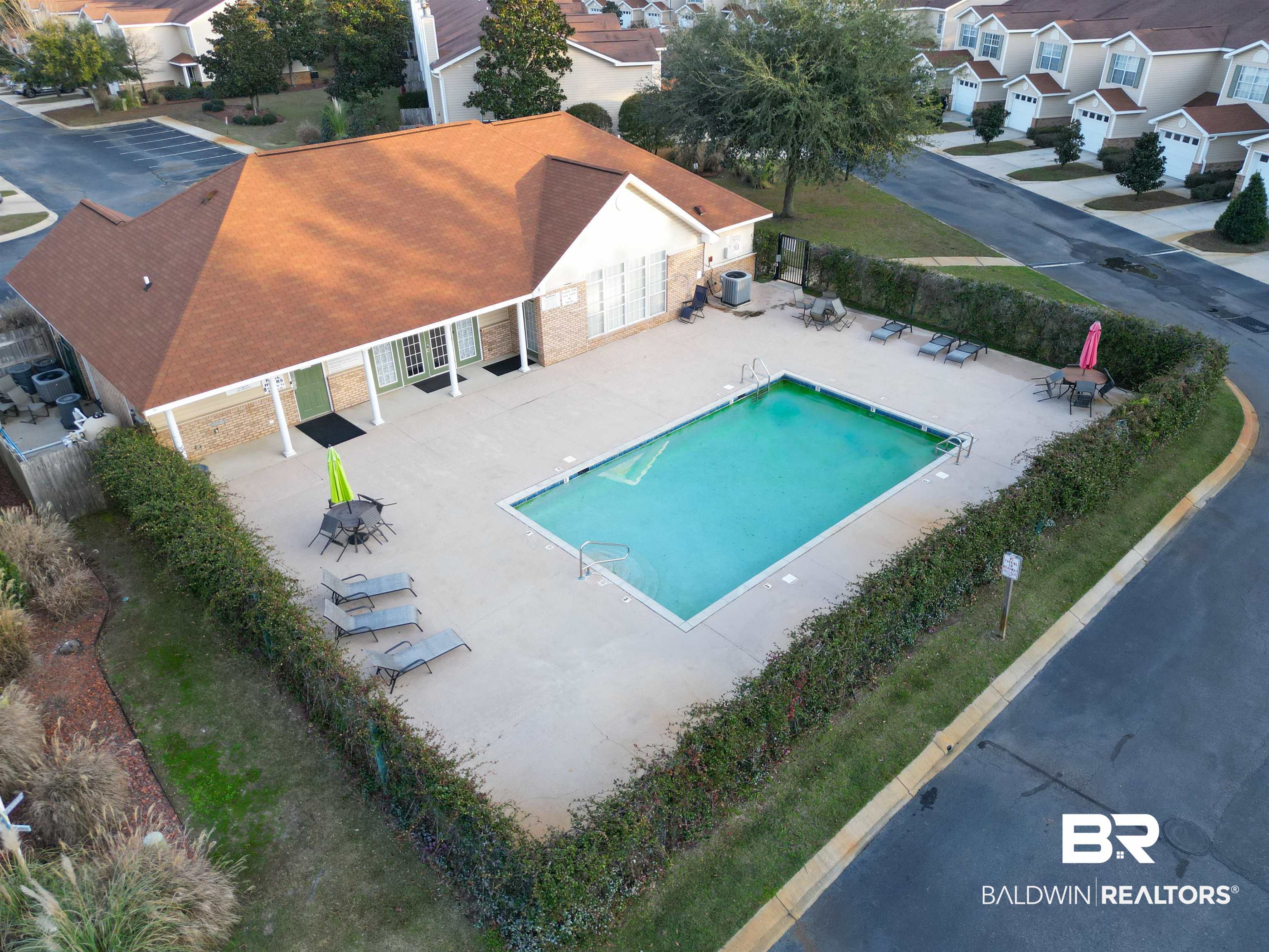 1517 Regency Road, Unit 125 Gulf Shores, AL 36542 - Photo 26 of 26 Community pool featuring a patio and a residential view