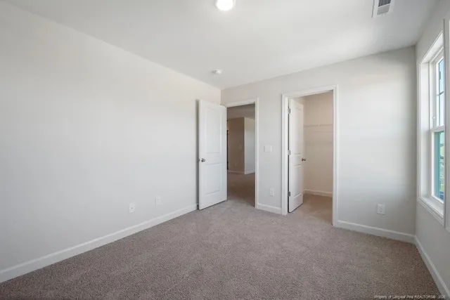 a view of a house with backyard and ocean view